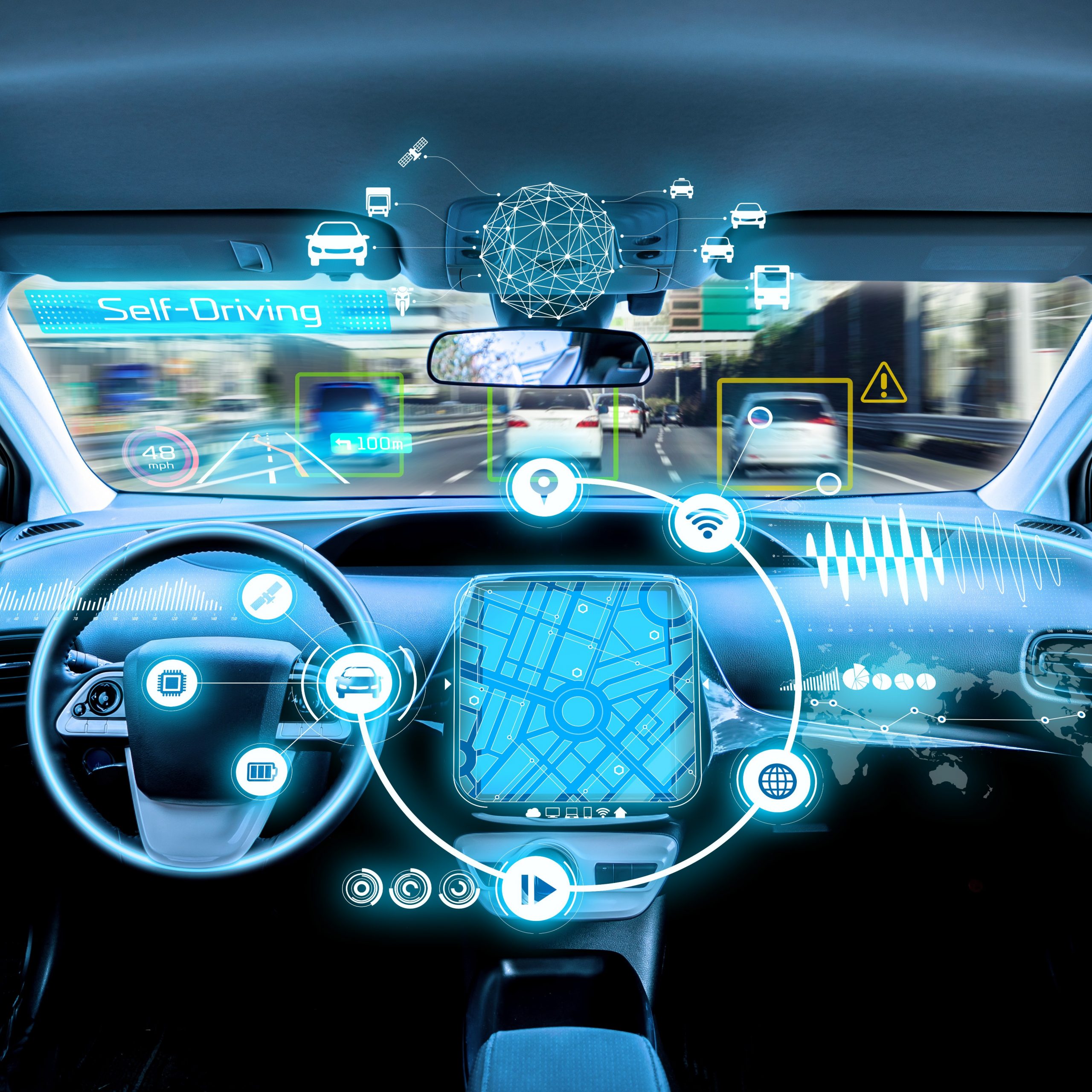A computerised image of a left-hand drive autonomous vehicle. The image shows the steering wheel and dashboard, with holographic connections between the car and other vehicles visible through the windscreen.