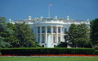 A photo of the White House on a clear, sunny day